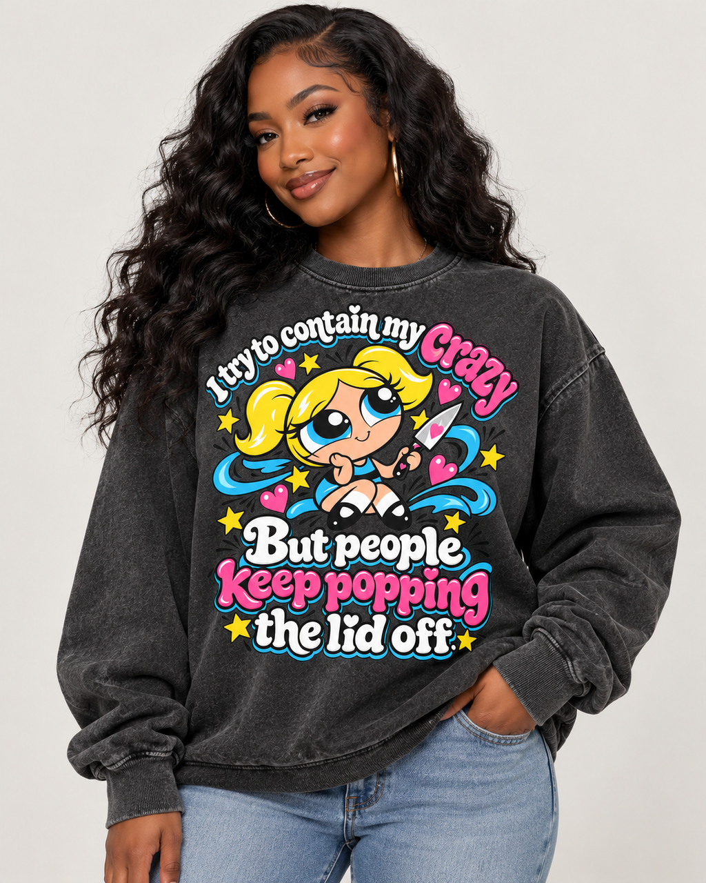 Comfort Colors Pepper crewneck sweatshirt featuring a colorful cartoon girl with pink, blue, and yellow accents and the saying "I Try to Contain My Crazy, But People Keep Popping the Lid Off."