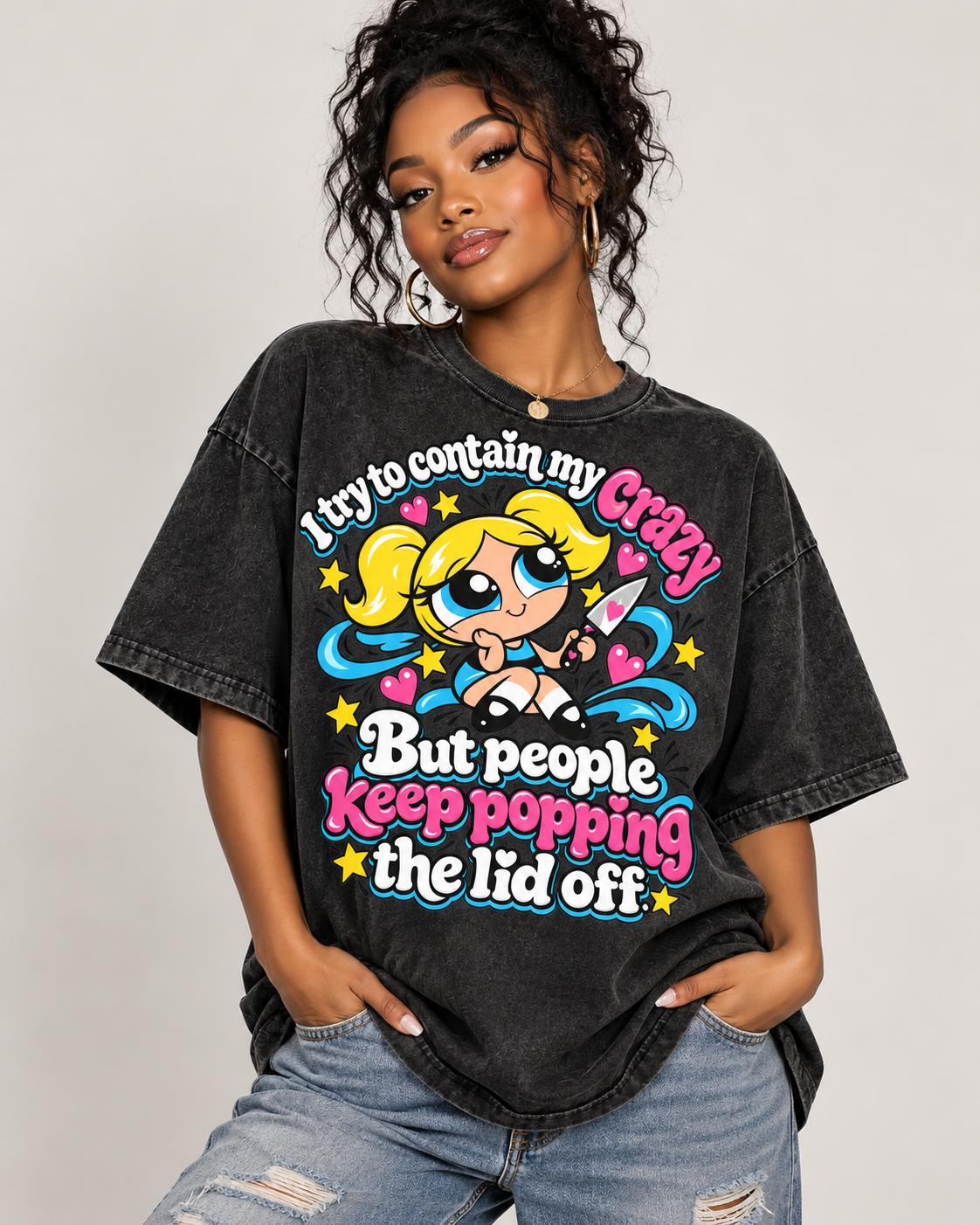 Comfort Colors Pepper oversized graphic T-shirt featuring a colorful cartoon girl with pink, blue, and yellow accents and the saying "I Try to Contain My Crazy, But People Keep Popping the Lid Off."
