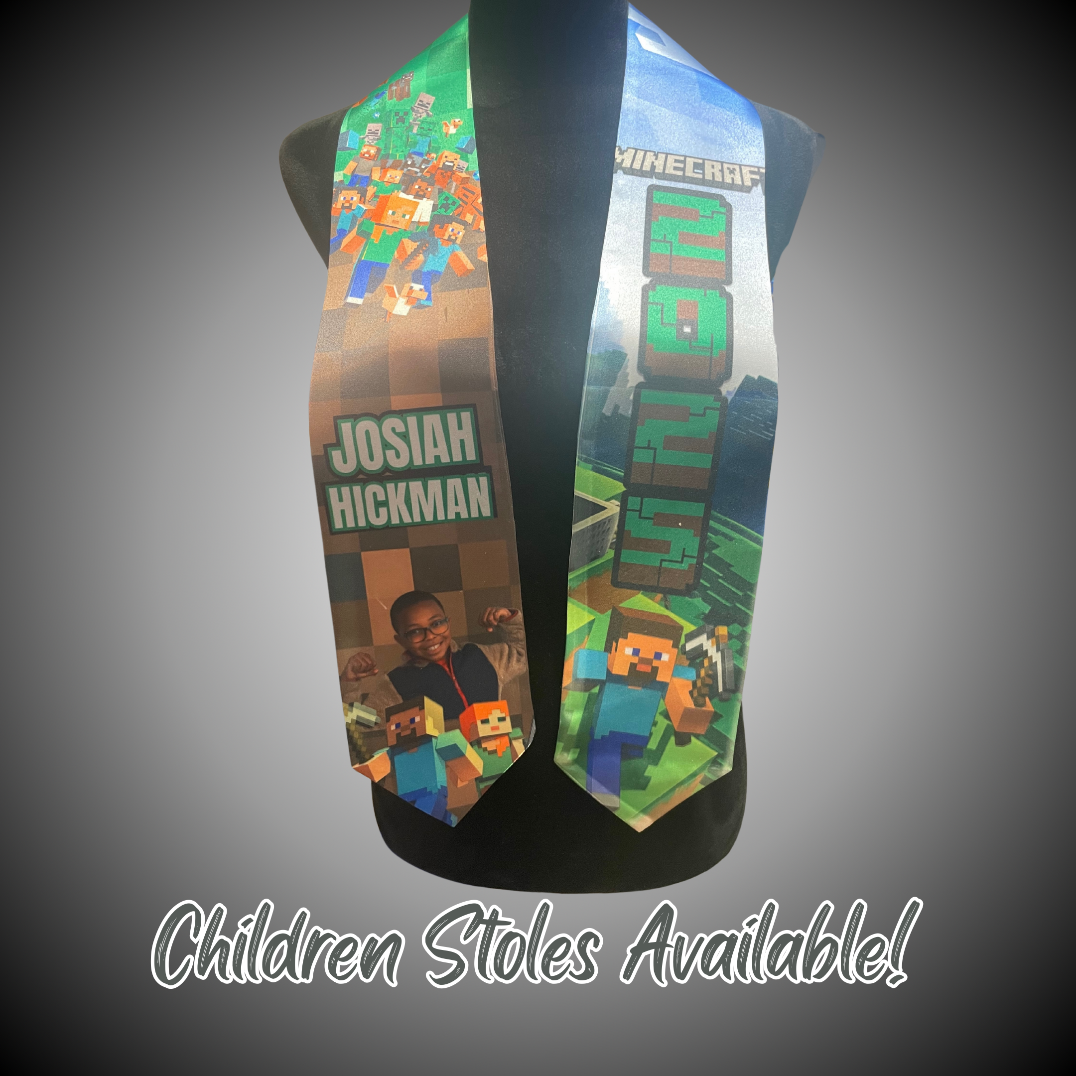 A graduation stole featuring custom design with two personal pictures, displayed on a mannequin. The stole has a gradient of colors and includes graphics and text.