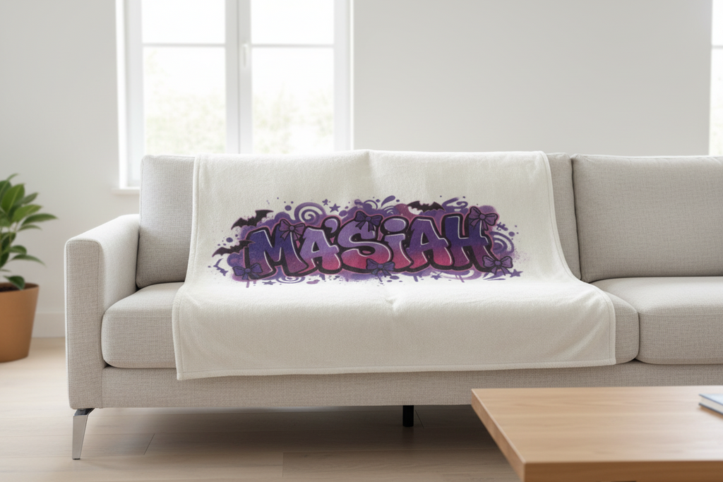White blanket with grafitti purple and black personalized name.